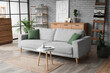 © Pixel-Shot - Interior of living room with wooden ladder, sofa and shelf units