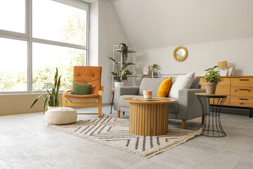 Sticker - Interior of light living room with mirror, grey sofa and armchair