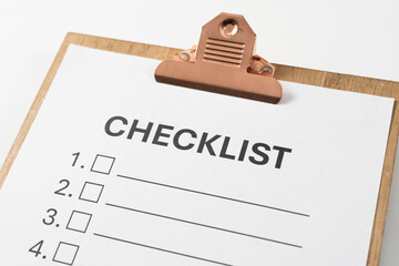 Checklist document on the clipboard