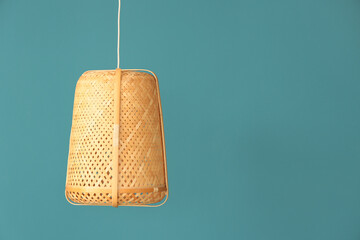 Wall Mural - Rattan pendant lamp on blue background