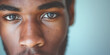 © J. Grayscale - A closeup of a young man with dark skin and expressive eyes, reflecting a sense of focus and introspection