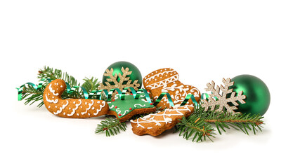 Christmas tree branches with balls, decorative snowflakes and gingerbread cookies on white background