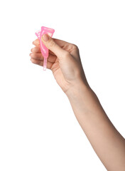 Wall Mural - Woman folding pink menstrual cup on white background, closeup