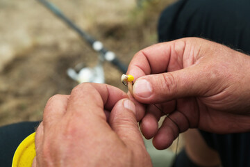 Sticker - Senior fisherman holding fishing equipment outdoors, closeup