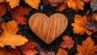© Your Hand Please - wooden heart rests on vibrant moss, surrounded by orange autumn leaves. This serene fall scene evokes feelings of warmth, love, and the natural cycles of life, blending nature and emotion