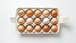 © Luxetify - A dozen brown eggs in a cardboard carton.