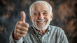 © Andres Mejia - Happy senior man smiling and showing thumbs up gesture