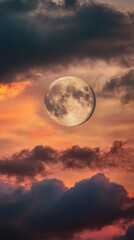 Wall Mural - Full moon rising over colorful sunset sky