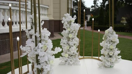 Wall Mural - a beautiful arch for a wedding ceremony in a park with chairs