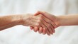 © WrongWay - A young hand holding an old hand, helping and caring for the elderly