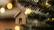 © Salander Studio - a wooden house shaped keychain is hanging on a christmas tree