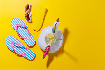 Poster - A vibrant summer vacation scene with flip flops, shades, and a floating flamingo with cocktail