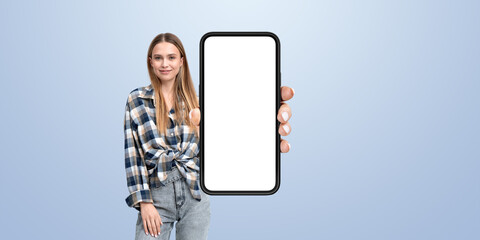 Woman hand showing big smartphone mockup screen, empty background