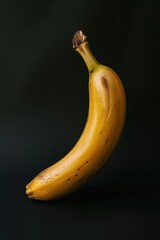 Wall Mural - Vibrant Banana on Dark Background