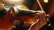 © putri syakilla - A close-up of a hand playing a violin, highlighting the instrument's details and craftsmanship.