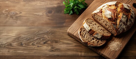 Wall Mural - Rye bread on a wooden cutting board. Copy space image. Place for adding text and design