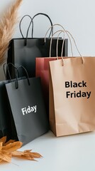 A collection of chic black shopping bags with 'Black Friday' emblazoned on them hangs against a minimalist white background, ideal for retail marketing visuals