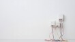 © Preecha - Electrical equipment with connected wires and power outlets, studio setup with clean layout, copy space for text, high-end magazine photography, deep depth of field, Product photography with high