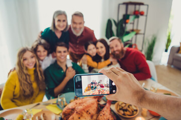 Poster - Photo of positive happy people celebrating thanksgiving day weekend photographing friendly family indoors room home