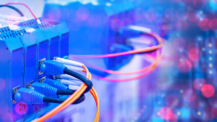 Poster - Network equipment. Internet technologies. Factory automation equipment. Network switches. Fiber optic wires are connected to internet equipment. Network infrastructure. Telecommunication tech