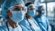 © Tanakorn - Closeup of a Female Healthcare Professional Wearing a Surgical Mask, Goggles, and a Scrubs Hat.