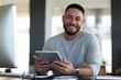 © kabir - Smiling Businessman Using Tablet in Office, Professional Work, Digital Technology, Remote Productivity