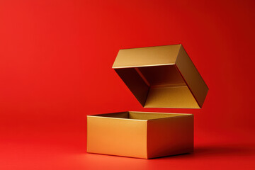 Wall Mural - open golden gift box floating on a red background, creating a luxurious and festive atmosphere