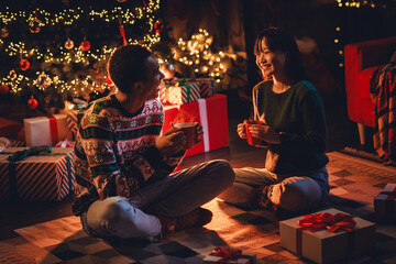 Sticker - Full body photo of nice young couple drinking tea wear christmas clothes enjoy cozy x-mas party decoration interior flat indoors