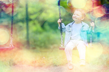 springtime, a boy in the spring swinging on a swing, leisure enjoyment childhood summer happy child