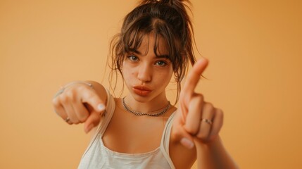 Poster - Young woman makes a peace sign with her fingers, a symbol of harmony and unity