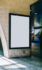 Clear Billboard in public place with blank copy space screen for advertising or promotional poster content, empty mock up Lightbox for information, blank display in station area with daylight