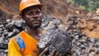 © Sittipol  - A miner holding a lump of raw coal, ready for transportation and processing
