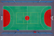 © ako-photography - Aerial view of a vibrant basketball court with red and green markings in a sunny environment