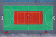 © ako-photography - Aerial view of a vibrant basketball court with colorful markings in an urban setting