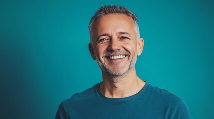 Canvas Print - A man with graying hair and a beard smiles at the camera.