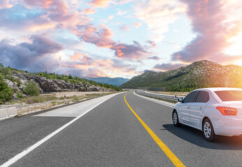 Wall Mural - The car is driving along the highway surrounded by picturesque nature.