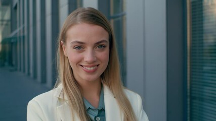 Wall Mural - Happy Caucasian woman businesswoman female joyful manager posing looking at camera in city street outdoors office. Cheerful executive girl smiling with white healthy teeth business company employment