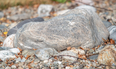 A large rock sits on a pile of rocks