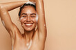 © Giorgi - Close-up of happy woman with glowing skin in sudsy shower