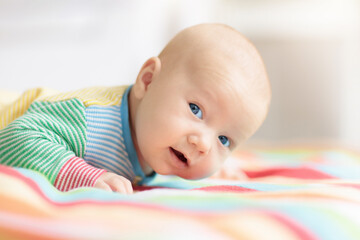 Wall Mural - little baby on white bed
