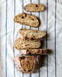 © Connect Images - Sliced artisan bread on a striped linen cloth.