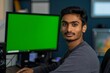© CogniLens - App display indian man in his 20s in front of a computer with a completely green screen