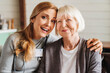 © InsideCreativeHouse - Portrait of senior woman with her caregiver at home