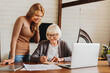 © InsideCreativeHouse - Beauty middle aged lady teaching her mom to use computer