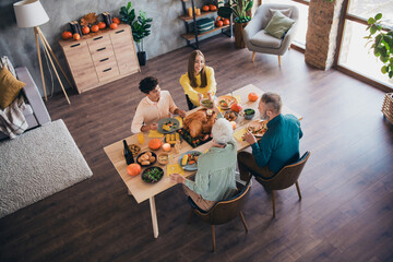 Canvas Print - High angle view photo of four friendly family members pass food talk celebrate thanksgiving dinner apartment indoors