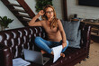 © InsideCreativeHouse - Thoughtful middle aged woman using laptop and checking documents while working remotely at home