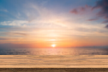 Wood table top on blur summer blue sea and sky background - can be used for display or montage your products