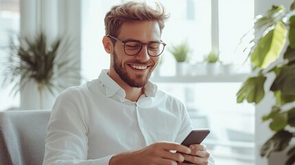 Canvas Print - Happy Man Using Smartphone in Modern Office Space