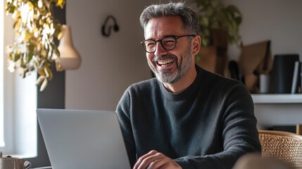 Canvas Print - Happy Man Working on Laptop in Cozy Home Office