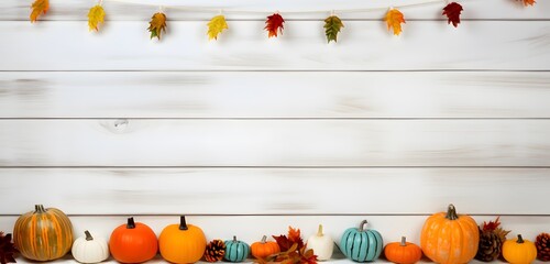 Wall Mural - autumnal white wooden background with pumpkins